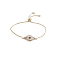 Detail of gold evil eye bracelet showing box chain and slider clasp for adjustable fit - Evil Eye / Golden Box Chain