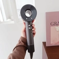 Modern bladeless ionic hair dryer in dark grey finish for hair care and styling - Space Gray