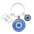 Blue evil eye keychain with silver glass pendant and metal eye charms on white background - Wave Texture (11)