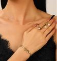 Gold bow jewelry set for women featuring pearl rings and matching bracelet on model - Stainless Steel Bowknot Pearl Earrings Ring Bracelet Set