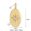 Detail of 16mm gold oval pendant featuring a starburst-set clear zircon on white background - Gold Oval Starburst with Zircon
