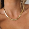 Detailed close-up of 18k gold-plated stainless steel snake chain necklace on collarbone - 5mm Herringbone Snake Chain 18inch / Gold