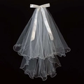 Short white multi-layer bridal veil with satin bow and pearl trim on black background - Double Layer Lettuce Edge Bow (Approx. 75cm - Hair Clip - with Artificial Pearls) / White