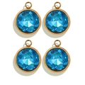 Set of four gold-rimmed round blue crystal charms with faceted blue gemstone surface - Round / Light Blue