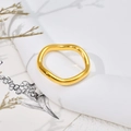 Detail of wavy golden stainless steel ring on minimalist props with soft lighting - US 6 / Thin Wave Ring J306 / Gold