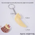 Realistic mini chicken wing keychain charm in pale yellow with silver metal ring - 5.8cm Boiled Chicken Wing Tip - Keychain