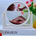 Reddish-brown and white flowing sand art in a circular white frame on a desk - 8 Inch White Frame Stand Coffee