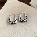 Detailed macro view of silver earrings featuring black leopard print enamel and U-shaped clasp - 42# Silver Leopard Spot U-shape Ear Cuff