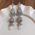 Macro detail of silver bohemian jhumka earrings with crystals on a ceramic plate - Crystal Pendant Boho Tassel (72#)