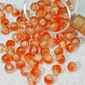 Macro shot of 10mm orange brushed glass beads with gold foil and crackle detail - Golden Orange