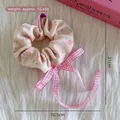 Chouchou floral avec nœud en ruban à carreaux roses, style vintage pour femmes - Chouchou Nœud Papillon