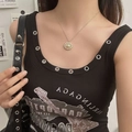 Close-up of gold pearl necklace with saturn planet charm on a model neck - Planet Orb Pearl Pendant Necklace (L0058XC) / Gold