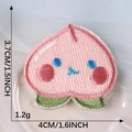 Cute pink peach embroidered patch with blue eyes and green leaves for clothing decor - Peach