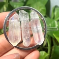 Silver circular hair clip with natural raw clear quartz crystals on a green background - Silver Circle Clear Crystal Slice