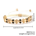 Detailansicht eines goldenen Kleeblatt-Armbands mit Emaille, Zirkonia und geflochtenem Seil - B00712-11 (Schwarzgold Kleeblatt Zirkon)