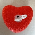 Top view of red heart night light with textured surface and elastic hand strap - 16cm with Elastic Strap / Red