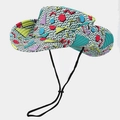 Close-up of colorful Memphis geometric pattern and metal eyelets on sun bucket hat - One Size / Green Geometric Pattern