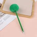 Detail of a green creative ballpoint pen with a fluffy pompom top on a pink background - 0.5mm / Green