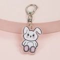 Cute acrylic keychain featuring a white cartoon rabbit design with a silver metal clasp - Sitting Rabbit