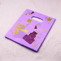 Stack of purple Happy Birthday plastic gift bags with yellow stars and cake design - Purple Happy Birthday Style (37) / 95 Pieces/Pack