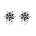 Macro detail of 18K gold plated flower earrings with blue and clear zircon crystals - Blue