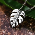 Polished silver monstera leaf pendant necklace on a delicate chain for women - White Gold