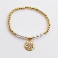 Golden beaded bracelet with white pearls and a sparkling starburst disc pendant - Gold Eight-pointed Star Pendant