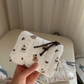 Detailed close-up of quilted cotton mini pouch with bear pattern and zipper detail - Striped Bear