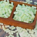 Detail of light green bamboo-shaped glass beads in a wooden tray for jewelry DIY - Pale Green (J119#)