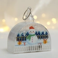 Close-up of LED Christmas snowman lantern with festive patterns and golden warm bokeh light - Snowman