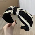 Padded headband in black and white striped knit fabric with a stylish knotted top design - S22 Black Striped Knit Knot Style