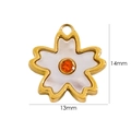 Macro detail of a 14k gold plated cherry blossom pendant with white petals and orange stone - Orange Zirconia