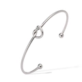 Detail view of silver knot cuff bracelet featuring round bead ends and a minimalist design - Knot Design / Silver