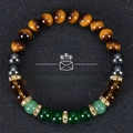 Tiger eye stone and green crystal beaded wealth bracelet on dark textured background - Tiger Eye Hematite Green Agate Style (Wealth-1)