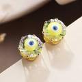 Macro detail of gold-plated evil eye stud earrings with zircon and blue enamel finish - Multicolor Eye Style (44233)