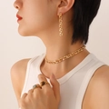Golden jewelry set with chain earrings, choker necklace and rings on a model - F640-Gold Color Champagne Zirconia Earrings