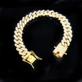Macro shot of gold-plated 12mm Cuban link bracelet with sparkling diamonds on black background - 18cm Gold Rhombus