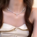 Elegant pearl choker featuring blue and pink beads with a metallic bow pendant - Bow Pearl Necklace X3698