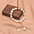 Elegant Baroque freshwater pearl bracelet with gold Virgin Mary charm on satin - Virgin Mary Pendant Freshwater Pearl Bracelet