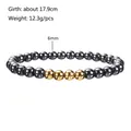 Detail view of 6mm beads elastic bracelet with grey hematite and gold accents - 6mm