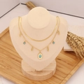 Double-layered gold necklace featuring turquoise pendants and leaf charms on a bust display - Oval Turquoise & Leaf Style (4#)