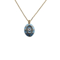 Macro shot of 18K gold plated evil eye pendant with blue enamel and colorful zircons - Blue