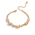 Elegante bracciale a farfalla placcato oro con cristalli rettangolari in acciaio inox - Farfalla con quattro diamanti rettangolari / Oro