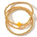 Three-piece gold beaded bracelet set with an orange cross charm and stacking elastic bands - Cross 3-Piece Set / Gold Orange