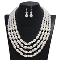 Detail of four-layer faux pearl necklace set with matching earrings on a black bust - 4-Layer Rice Bead Pearl Necklace Earring Set