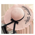 Pink straw sun hat featuring Hello Sunshine embroidery and a black ribbon bow detail - Light Pink Frayed Edge Hello Sunshine Embroidery