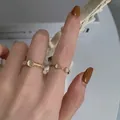 Elegant gold woven cat eye stone open ring set shown on model in a minimalist setting - Gold Textured Gemstone Rings Set (J1657)