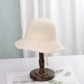 Creamy white woven sun hat with breathable texture displayed on a wooden stand - M (56-58cm) / Off White