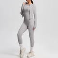Detailed view of grey three-piece yoga set with zip jacket and high-waist leggings - Frost Grey