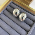 Macro detail of silver bean-shaped stud earrings in a grey velvet jewelry box organizer - Silver Medium
